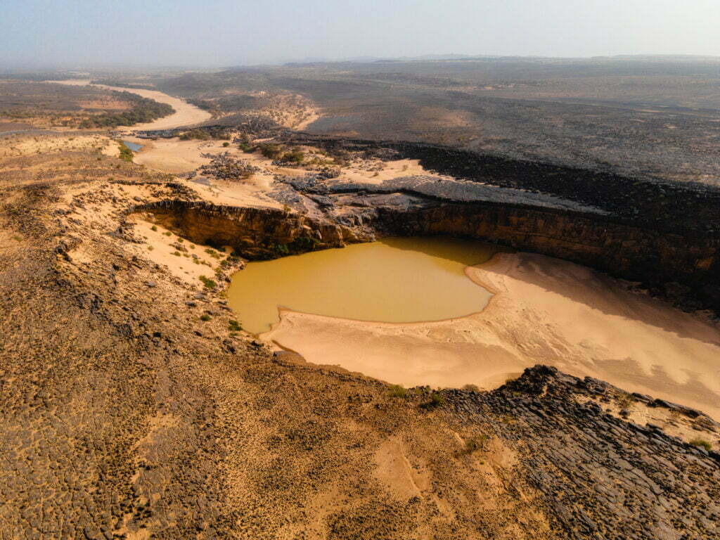 The Matmata Guelta containing the desert crocodiles in the Tagant region of the Sahara Desert of Mauritania